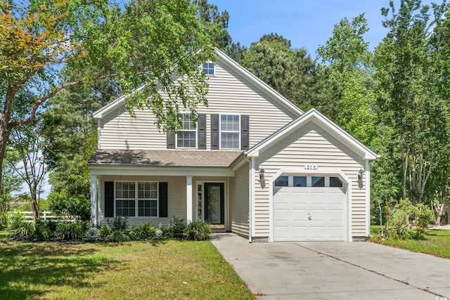 traditional home with an attached garage, driveway, and a front yard