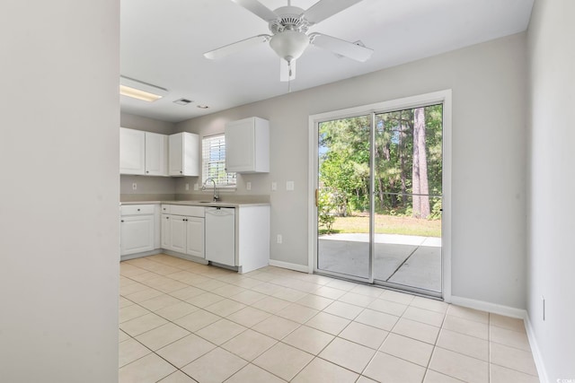 kitchen with dishwasher, a sink, baseboards, light countertops, and white cabinetry
