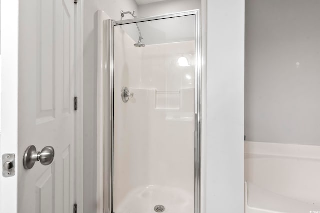 full bathroom featuring a stall shower