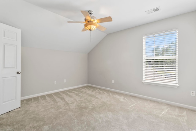 bonus room with ceiling fan, light carpet, baseboards, lofted ceiling, and visible vents