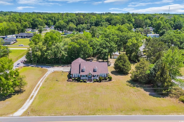 birds eye view of property with a wooded view