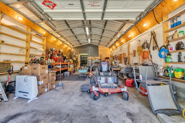 garage featuring ceiling fan and a workshop area