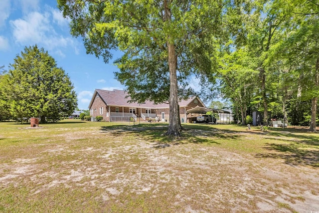 view of yard featuring a detached carport