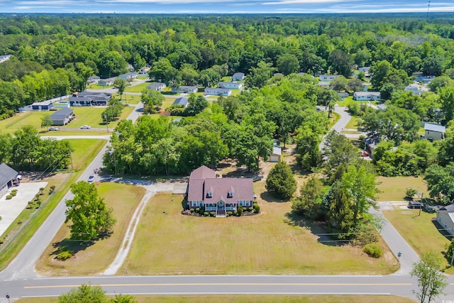bird's eye view with a forest view and a residential view