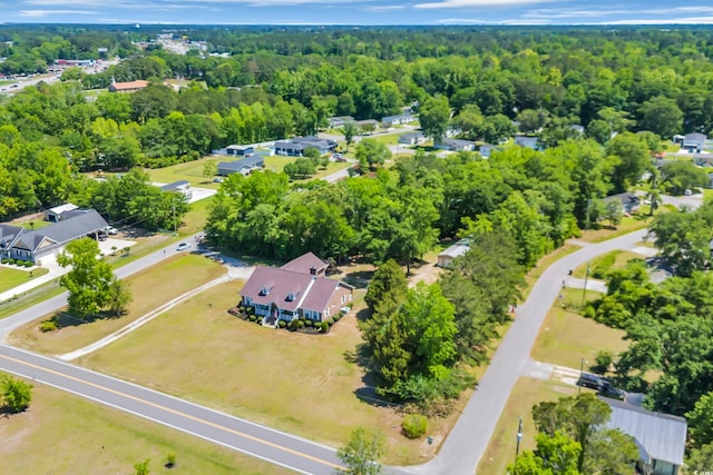 birds eye view of property featuring a view of trees and a residential view