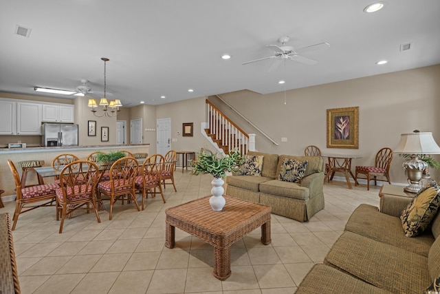 215-B S Dogwood Dr, Surfside Beach, SC 29575 - living area featuring recessed lighting, ceiling fan with notable chandelier, light tile patterned floors, and stairway