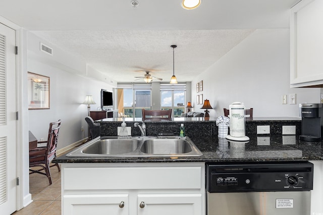 kitchen featuring visible vents, a ceiling fan, white cabinetry, a sink, and dishwasher