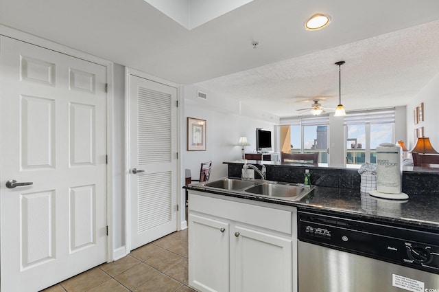 1707 Perrin Dr Unit 802, North Myrtle Beach, SC 29582 - kitchen featuring stainless steel dishwasher, dark countertops, a sink, light tile patterned floors, and open floor plan