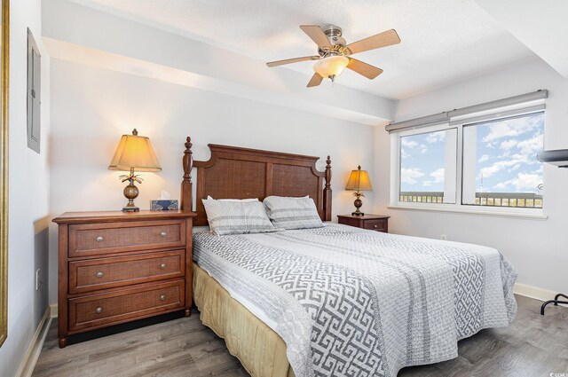 1707 Perrin Dr Unit 802, North Myrtle Beach, SC 29582 - bedroom with light wood finished floors, baseboards, and a ceiling fan