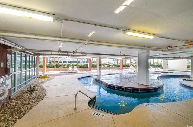 1707 Perrin Dr Unit 802, North Myrtle Beach, SC 29582 - indoor pool featuring an in-ground hot tub and a patio
