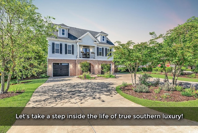 130 Hagar Brown Rd, Murrells Inlet, SC 29576 - view of front of home featuring brick siding, an attached garage, and driveway