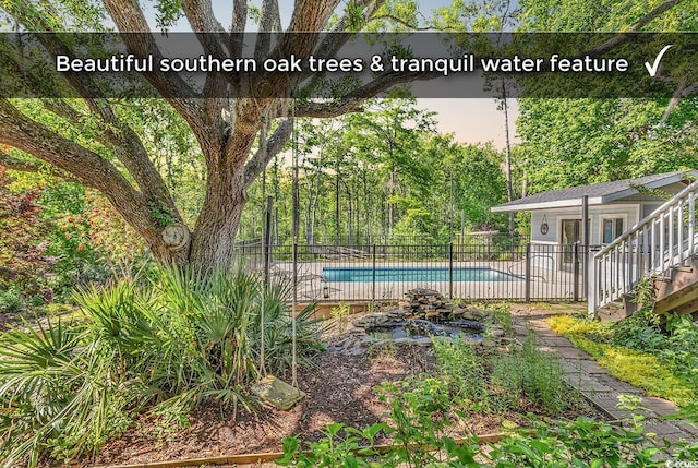130 Hagar Brown Rd, Murrells Inlet, SC 29576 - view of swimming pool with a fenced in pool, fence, an outdoor structure, and an exterior structure