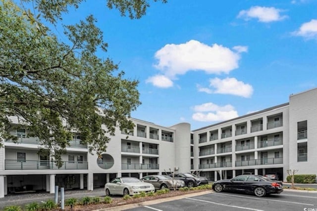 view of property with uncovered parking
