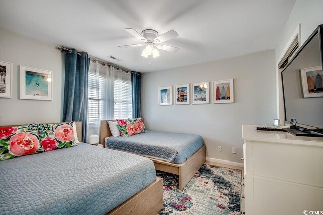 201 N Hillside Dr Unit 311-A, North Myrtle Beach, SC 29582 - bedroom featuring visible vents, a ceiling fan, and baseboards