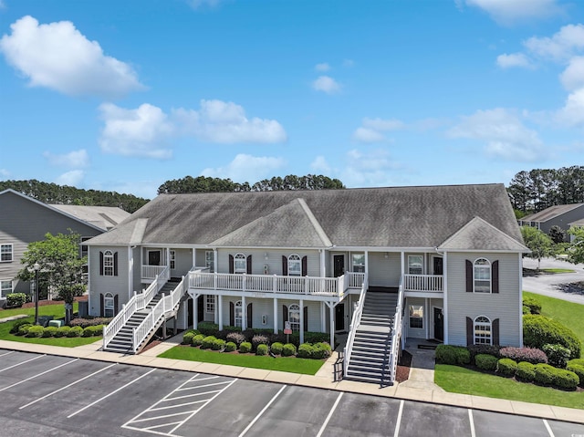 217 Wando River Rd Unit 12-H, Myrtle Beach, SC 29579 - view of property with stairway and uncovered parking