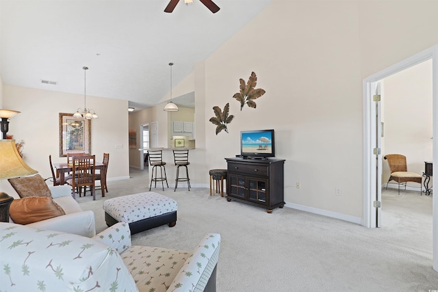 217 Wando River Rd Unit 12-H, Myrtle Beach, SC 29579 - living room with light colored carpet, ceiling fan, baseboards, a chandelier, and high vaulted ceiling