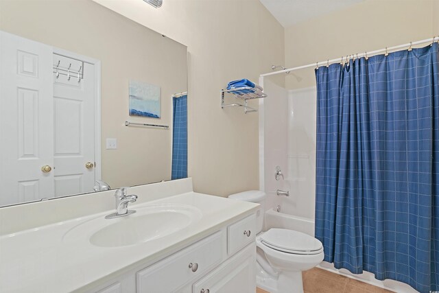 217 Wando River Rd Unit 12-H, Myrtle Beach, SC 29579 - bathroom featuring tile patterned flooring, toilet, vanity, and shower / bathtub combination with curtain
