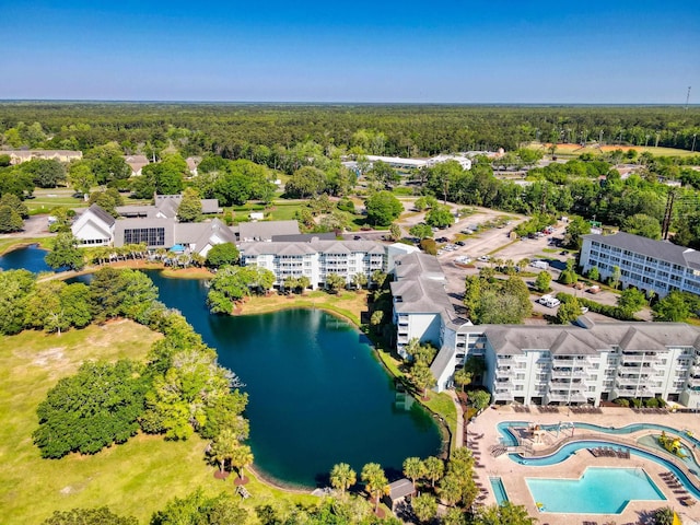 bird's eye view with a water view and a view of trees