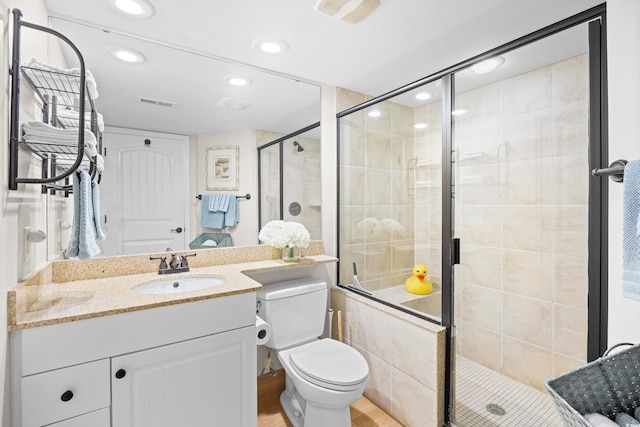 bathroom featuring a shower stall and visible vents