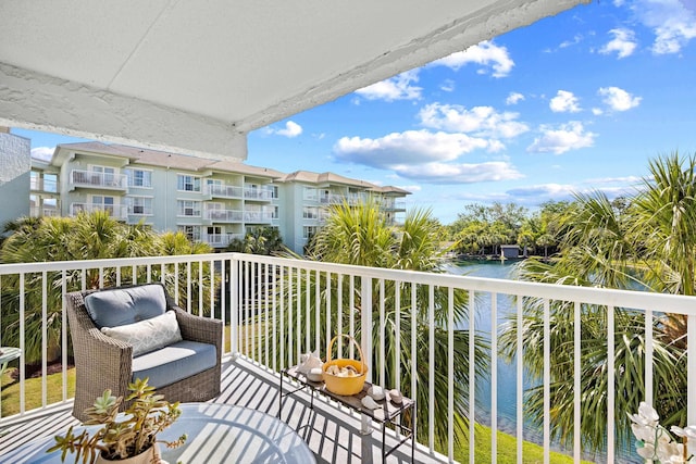 balcony featuring a water view