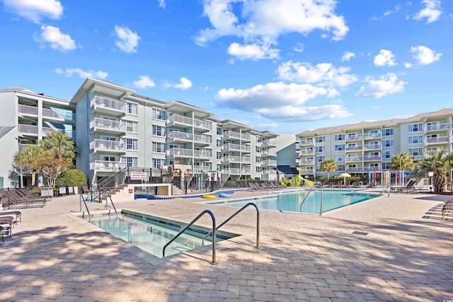community pool with a patio