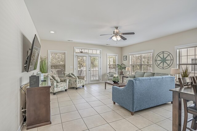 living room featuring light tile patterned floors, a ceiling fan, and recessed lighting
