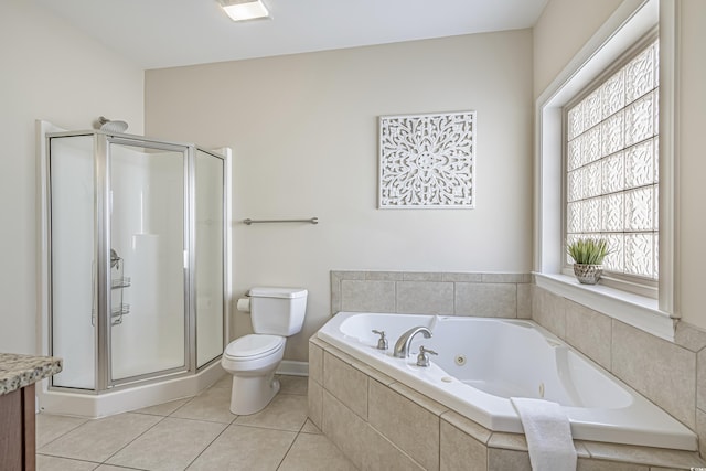 bathroom with vanity, a whirlpool tub, a stall shower, and toilet