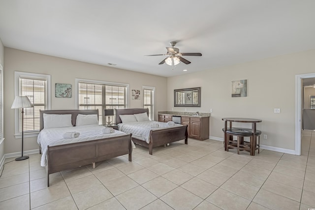 bedroom featuring baseboards, ceiling fan, light tile patterned flooring, and visible vents
