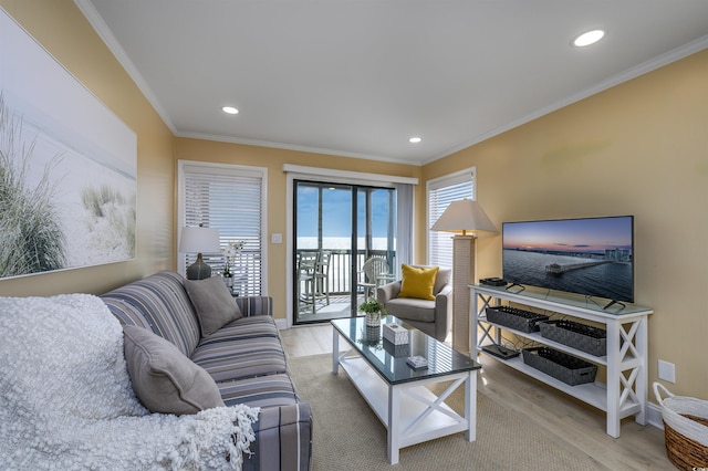 living room with crown molding, recessed lighting, and light wood finished floors