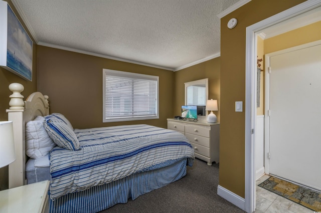 carpeted bedroom with crown molding, baseboards, and a textured ceiling