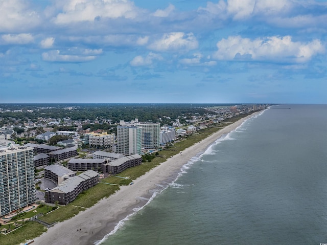 bird's eye view featuring a water view and a beach view