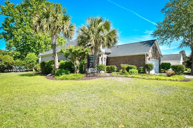 5813 Mossy Oaks Dr, North Myrtle Beach, SC 29582 - exterior space with a shingled roof, an attached garage, a front lawn, and brick siding