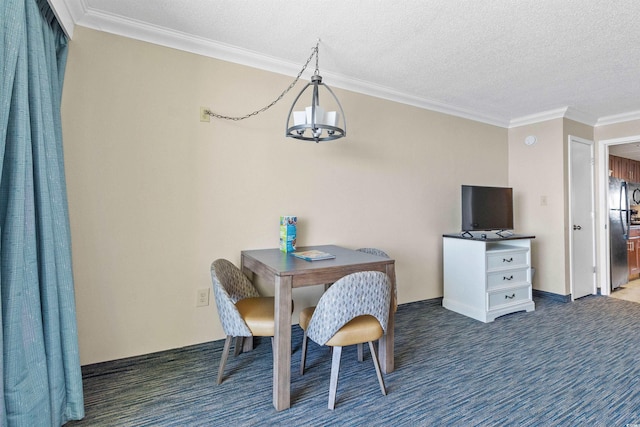 dining space featuring dark carpet, ornamental molding, and a textured ceiling