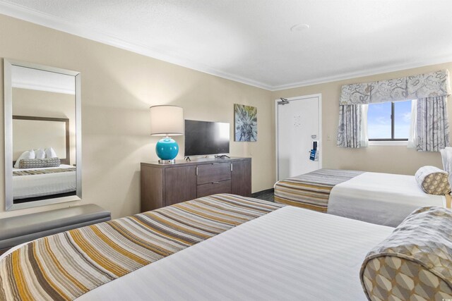 1105 S Ocean Blvd Unit 1024, Myrtle Beach, SC 29572 - bedroom featuring crown molding
