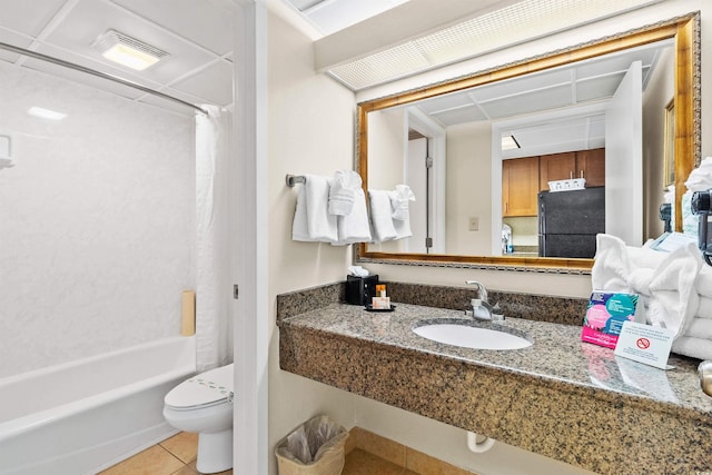 bathroom featuring a sink, tile patterned flooring, toilet, shower / bathtub combination with curtain, and visible vents