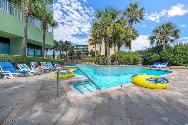 community pool with a patio