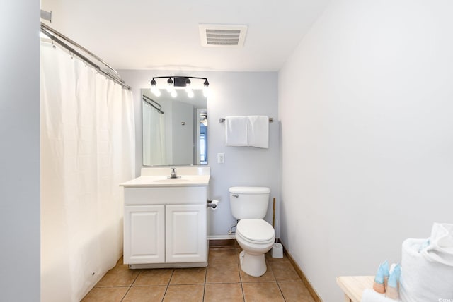 bathroom with visible vents, vanity, toilet, tile patterned floors, and a shower with curtain