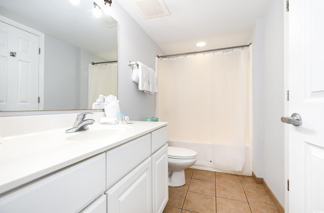 bathroom with vanity, shower / tub combo, tile patterned floors, and toilet