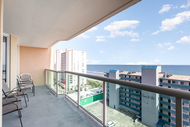 balcony with a water view and a city view