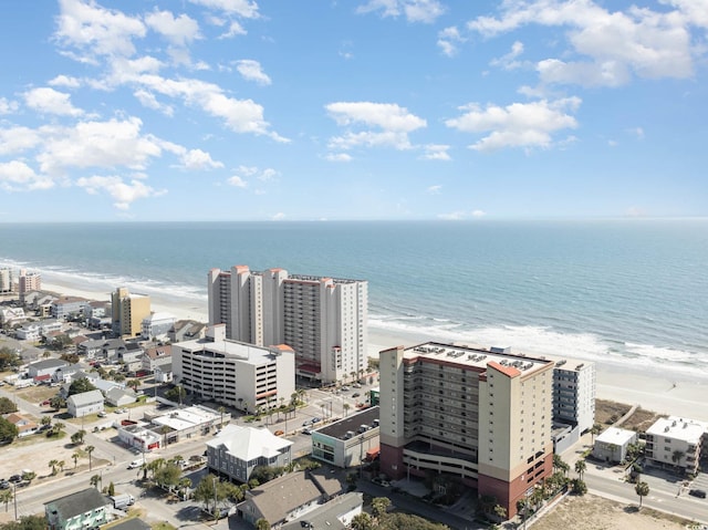 birds eye view of property featuring a water view and a view of the beach
