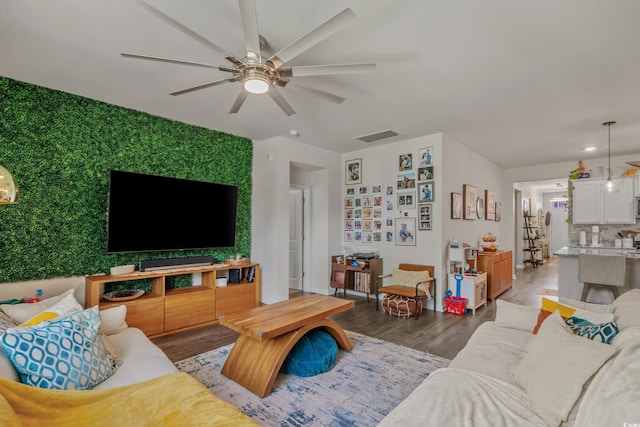 1011 Maxwell Dr, Little River, SC 29566 - living room with visible vents, baseboards, ceiling fan, and wood finished floors
