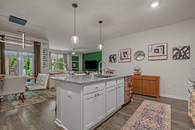 1011 Maxwell Dr, Little River, SC 29566 - kitchen with stainless steel dishwasher, open floor plan, ceiling fan, a sink, and dark wood finished floors