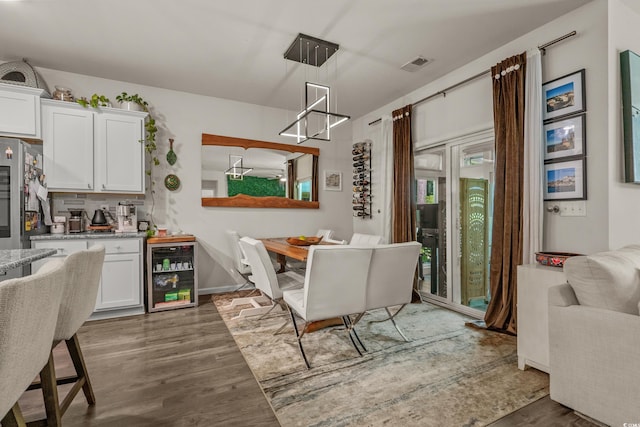 1011 Maxwell Dr, Little River, SC 29566 - dining room featuring baseboards, dark wood-type flooring, beverage cooler, and visible vents