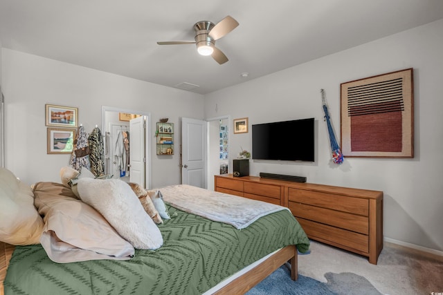 1011 Maxwell Dr, Little River, SC 29566 - bedroom with baseboards, ceiling fan, light carpet, and a walk in closet