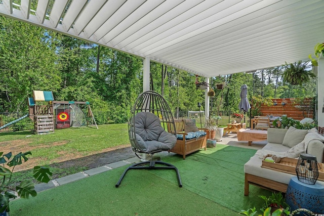 1011 Maxwell Dr, Little River, SC 29566 - view of patio / terrace featuring an outdoor living space, a fenced backyard, and a playground