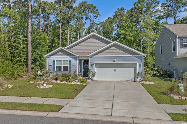 1011 Maxwell Dr, Little River, SC 29566 - view of front of house featuring driveway, a front yard, and a garage
