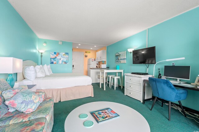 6803 N Ocean Blvd Unit 328, Myrtle Beach, SC 29572 - carpeted bedroom with freestanding refrigerator and a desk