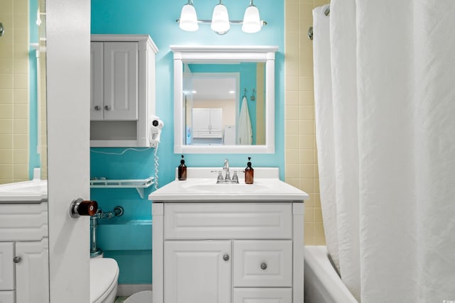 6803 N Ocean Blvd Unit 328, Myrtle Beach, SC 29572 - bathroom featuring toilet, vanity, and shower / tub combo with curtain