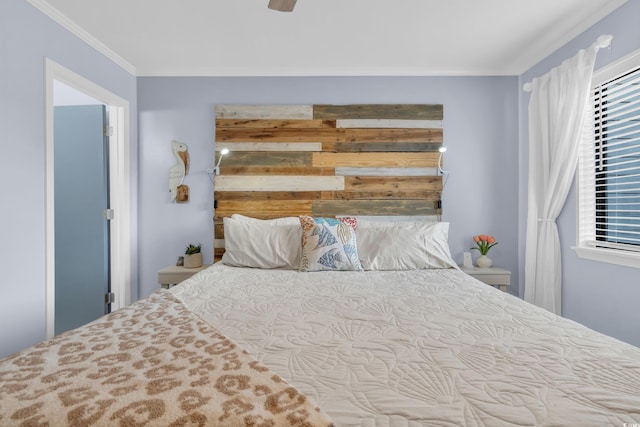 bedroom with ceiling fan and ornamental molding