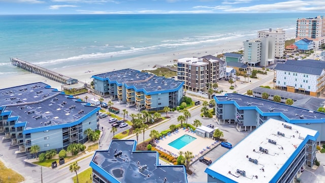bird's eye view with a water view and a view of the beach